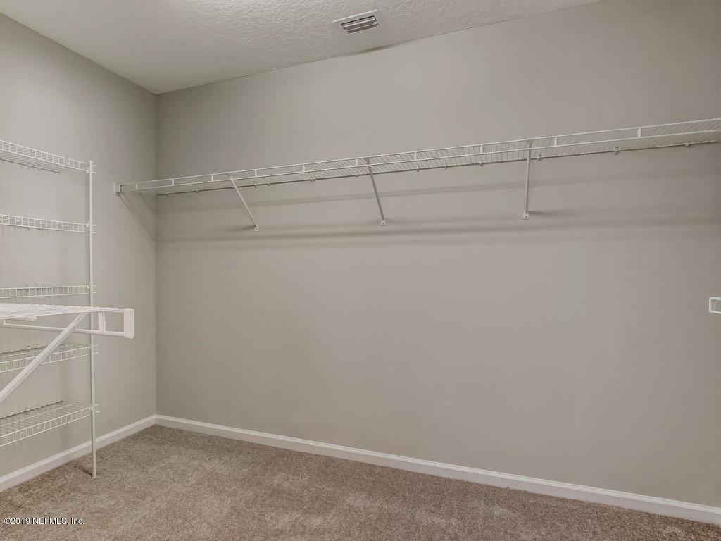 648 Porta Rosa Circle St. Augustine, FL 32092 - Photo 32 of 59 a view of an empty walk in closet
