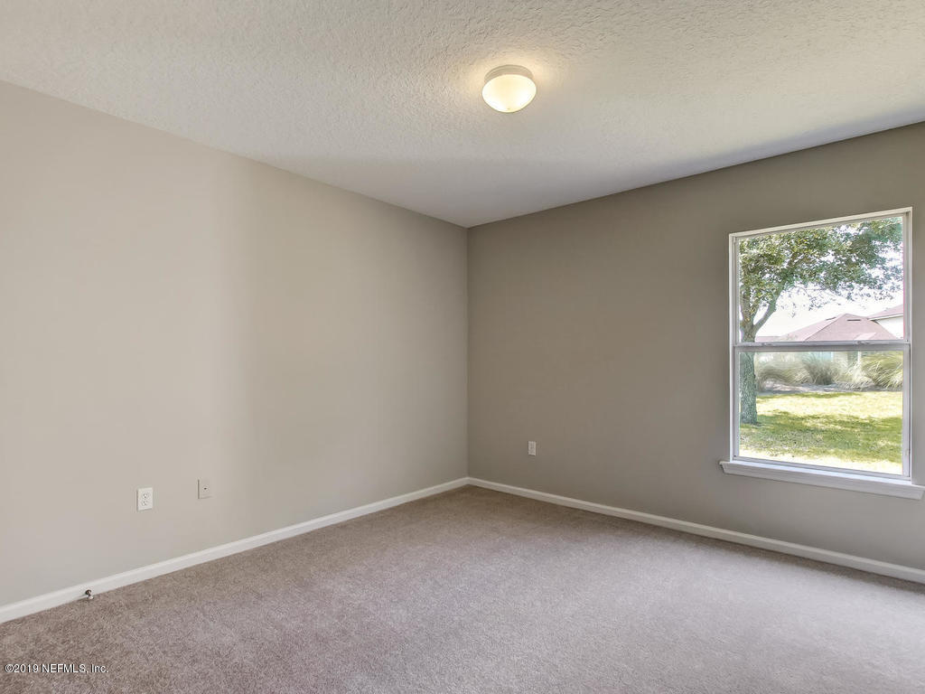 648 Porta Rosa Circle St. Augustine, FL 32092 - Photo 36 of 59 an empty room with a window