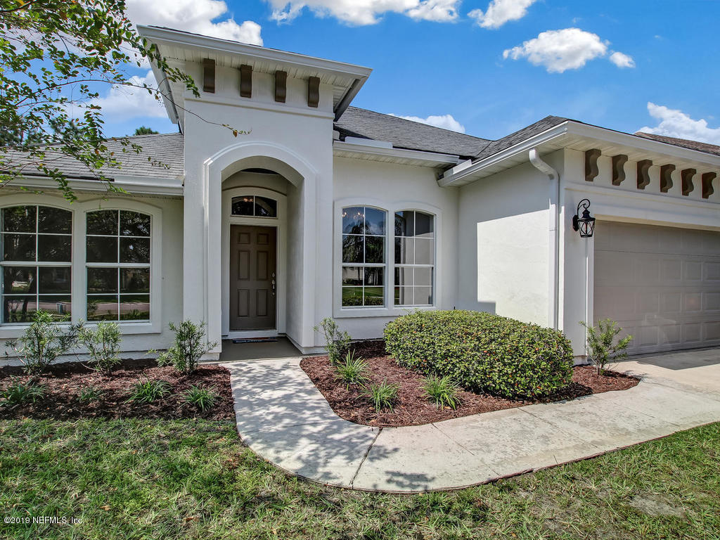648 Porta Rosa Circle St. Augustine, FL 32092 - Photo 4 of 59 a front view of a house with a yard
