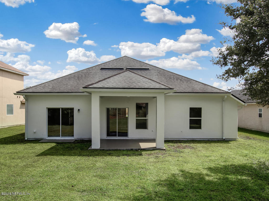 648 Porta Rosa Circle St. Augustine, FL 32092 - Photo 46 of 59 a view of a house with a backyard