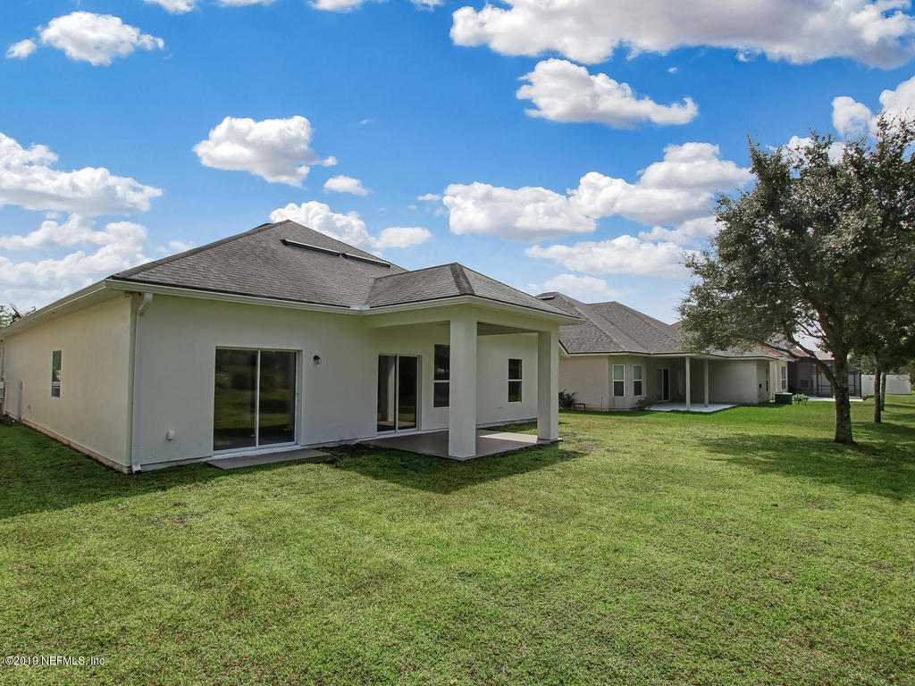 648 Porta Rosa Circle St. Augustine, FL 32092 - Photo 47 of 59 a view of a house with a yard