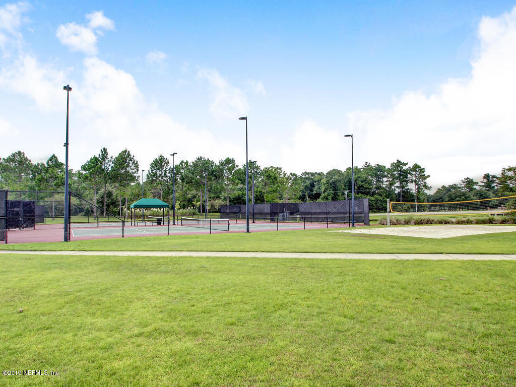 648 Porta Rosa Circle St. Augustine, FL 32092 - Photo 57 of 59 a view of a big yard with a large trees