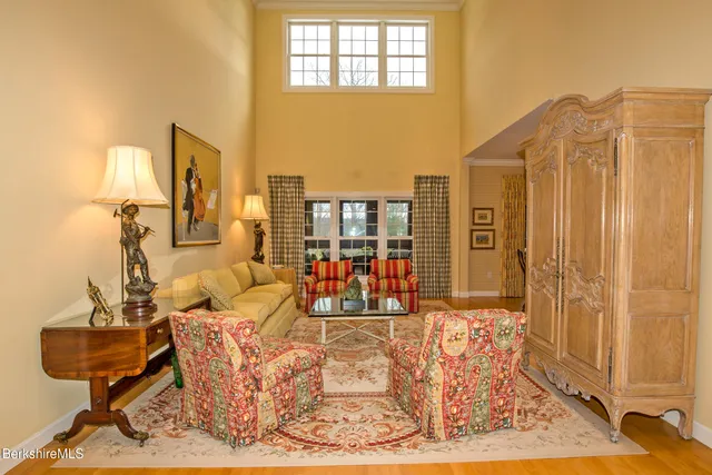 a bedroom with a bed and a table