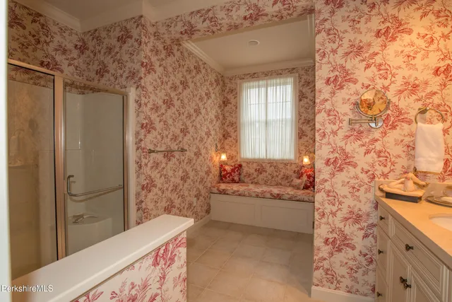 a bedroom with two beds and a dresser