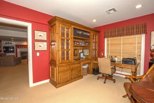a view of a patio with a dining table and chairs with wooden floor and fence