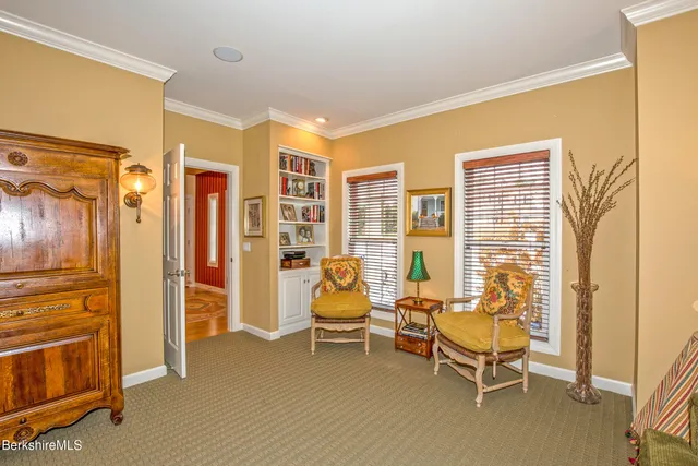 a bedroom with a bed and a lamp