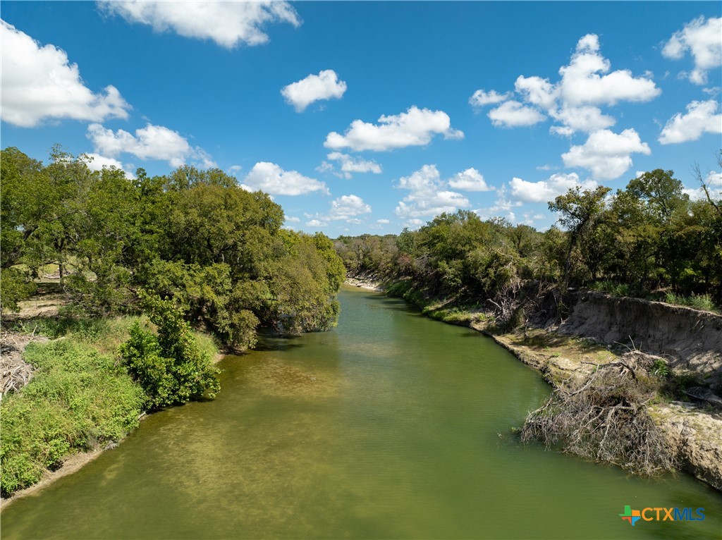 2 Lampasas River Place Kempner, TX 76539 - Photo 5 of 5 a view of a lake with lawn chairs and plants
