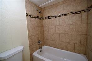 12818 Midway Road, Unit 2078 Dallas, TX 75244 - Photo 10 of 17 full bath in primary BR