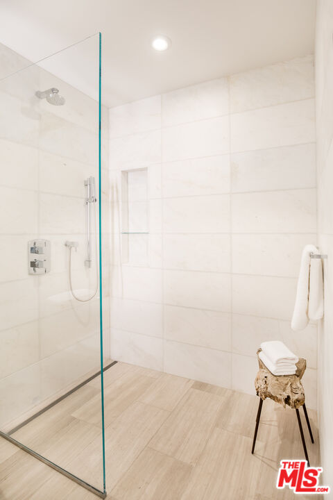 8600 Wilshire Boulevard, Unit GF15 Beverly Hills, CA 90211 - Photo 16 of 26 a bathroom with a shower and a toilet