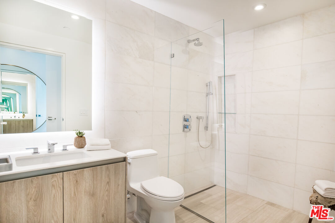 8600 Wilshire Boulevard, Unit GF15 Beverly Hills, CA 90211 - Photo 17 of 26 a bathroom with a sink toilet and shower