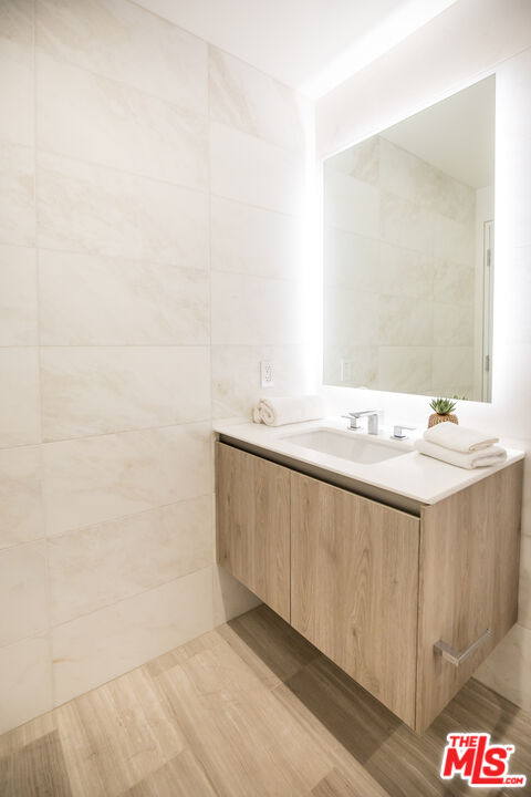 8600 Wilshire Boulevard, Unit GF15 Beverly Hills, CA 90211 - Photo 18 of 26 a bathroom with a sink and a mirror