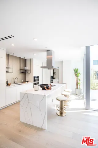 a kitchen with sink and cabinets