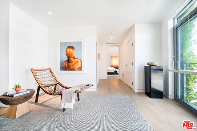 a view of a swimming pool with outdoor seating and plants