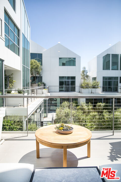 8600 Wilshire Boulevard, Unit GF15 Beverly Hills, CA 90211 - Photo 23 of 26 a view of a swimming pool with outdoor seating and plants