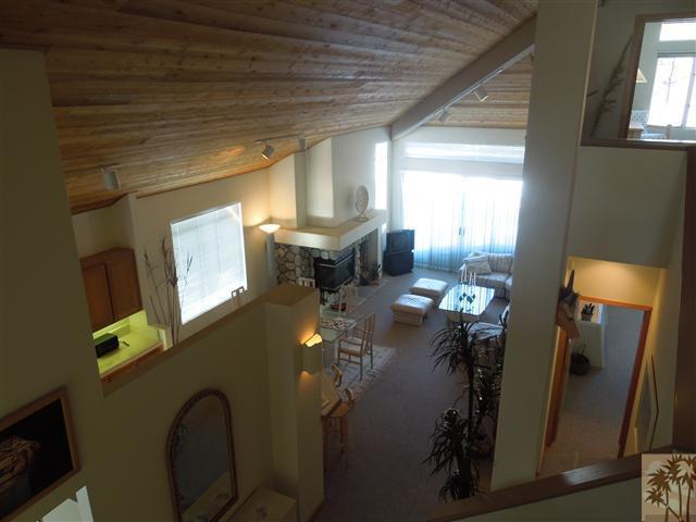 524 Golden Creek Road Mammoth Lakes, CA 93546 - Photo 5 of 12 a living room with furniture and a flat screen tv