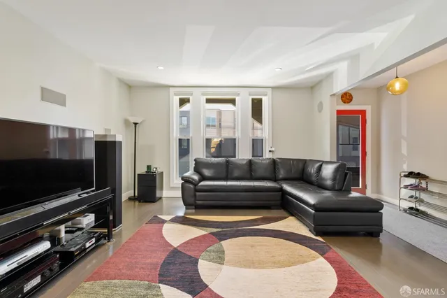 a kitchen with kitchen island a counter top space a sink stainless steel appliances and cabinets