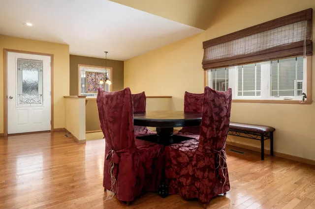 a view of a dining room with furniture window and wooden floor