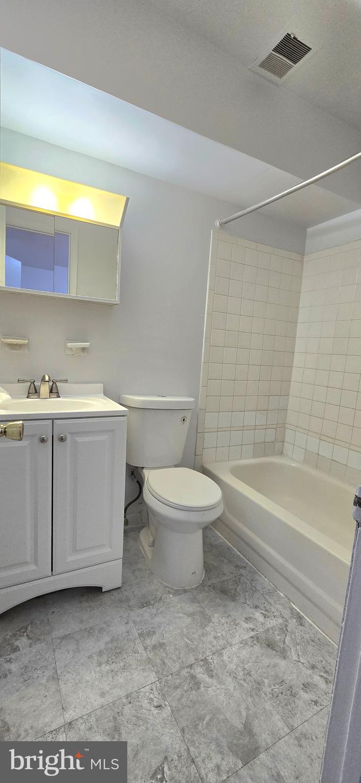 4641 6th Street Southeast Washington, DC 20032 - Photo 6 of 6 a bathroom with a toilet a sink and bathtub