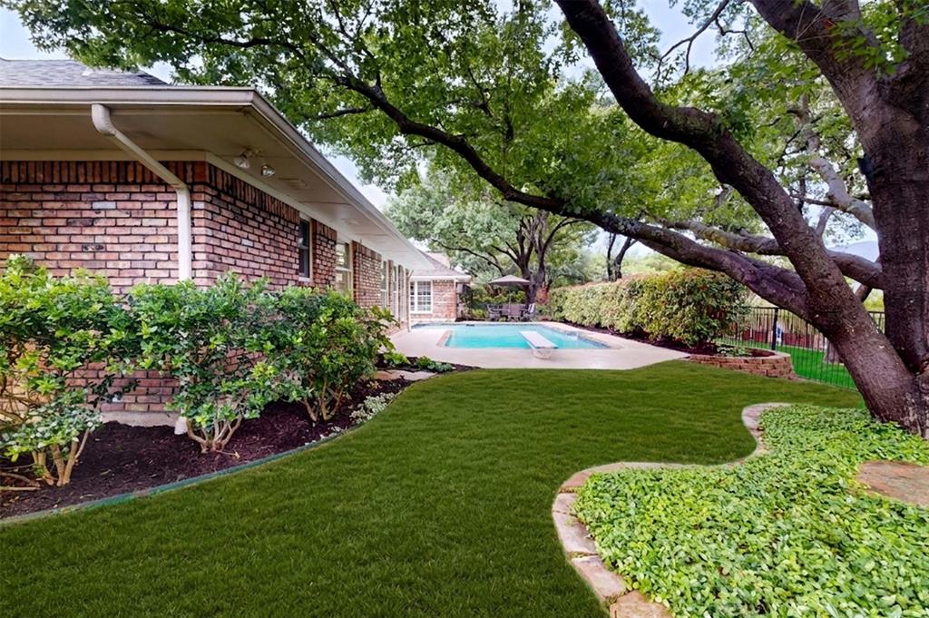 2405 Wing Point Lane Plano, TX 75093 - Photo 37 of 39 a view of a backyard with a garden