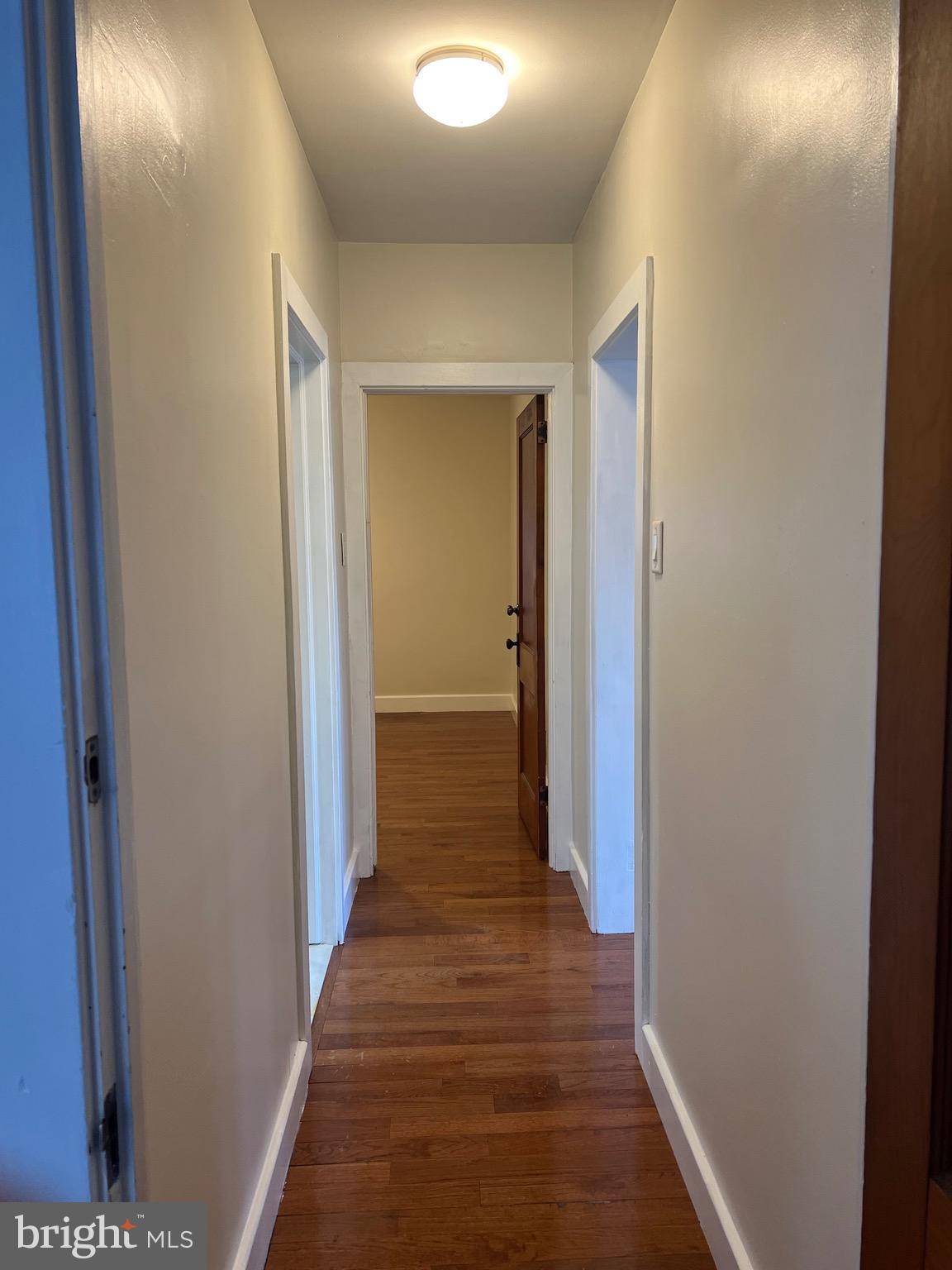 4950 Perkiomen Avenue Reading, PA 19606 - Photo 15 of 21 a view of a hallway with wooden floor