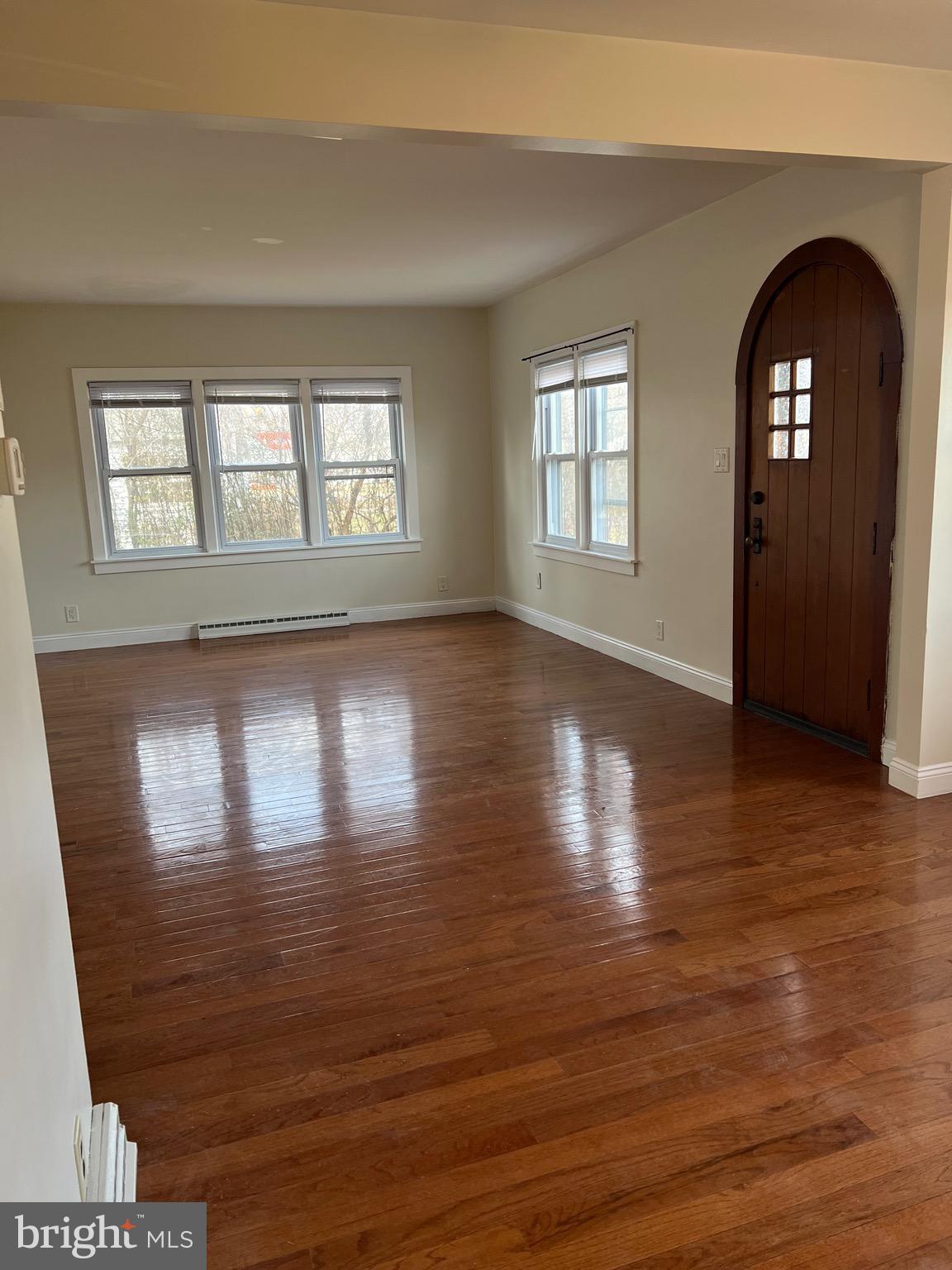 4950 Perkiomen Avenue Reading, PA 19606 - Photo 17 of 21 a view of empty room with window and wooden floor