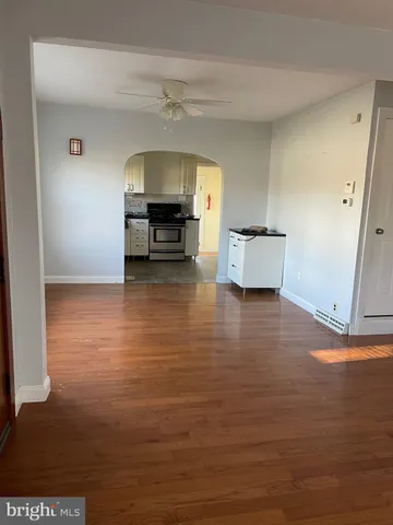 a view of kitchen with furniture and wooden floor