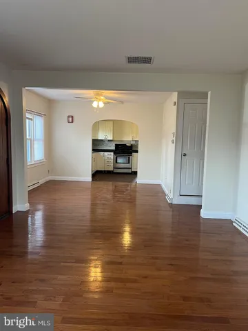 a view of a livingroom with wooden floor