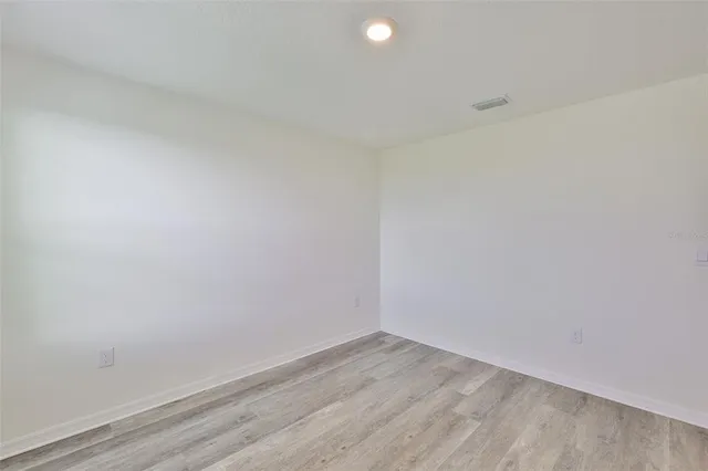 a bathroom with a toilet and shower curtain