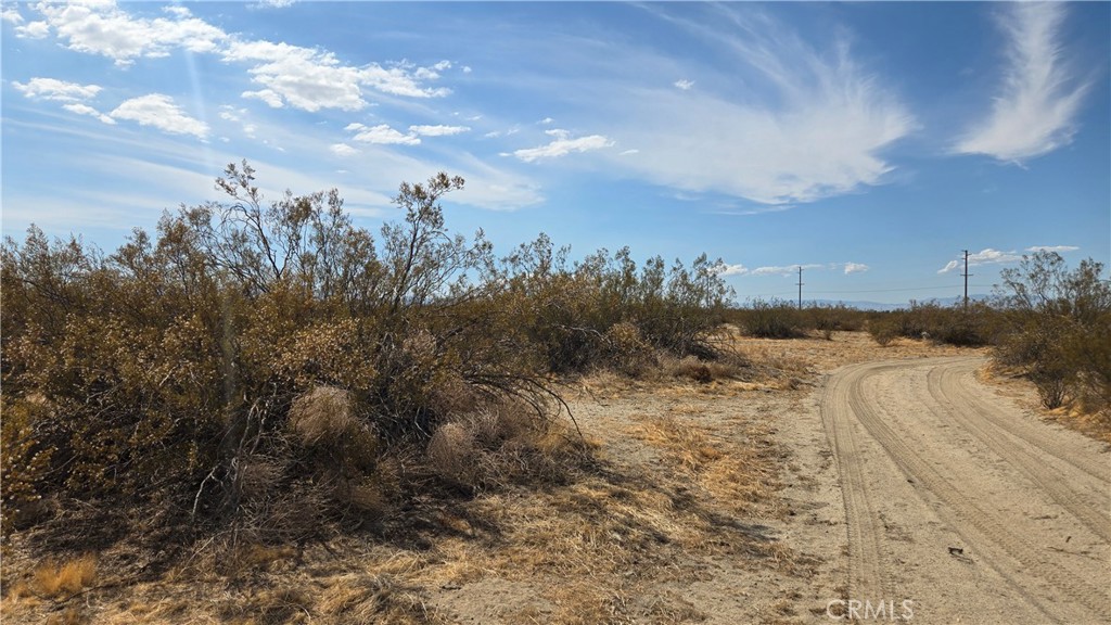 0 Palmdale Boulevard Littlerock, CA 93543 - Photo 26 of 28 a view of a dry yard with wooden fence