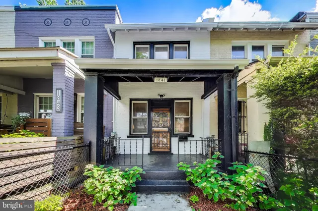 a front view of a house with a porch