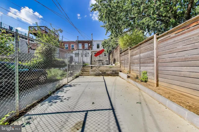 a view of a pathway with a patio
