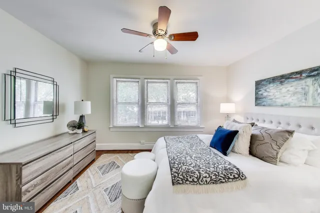 a spacious bedroom with a large bed and a window