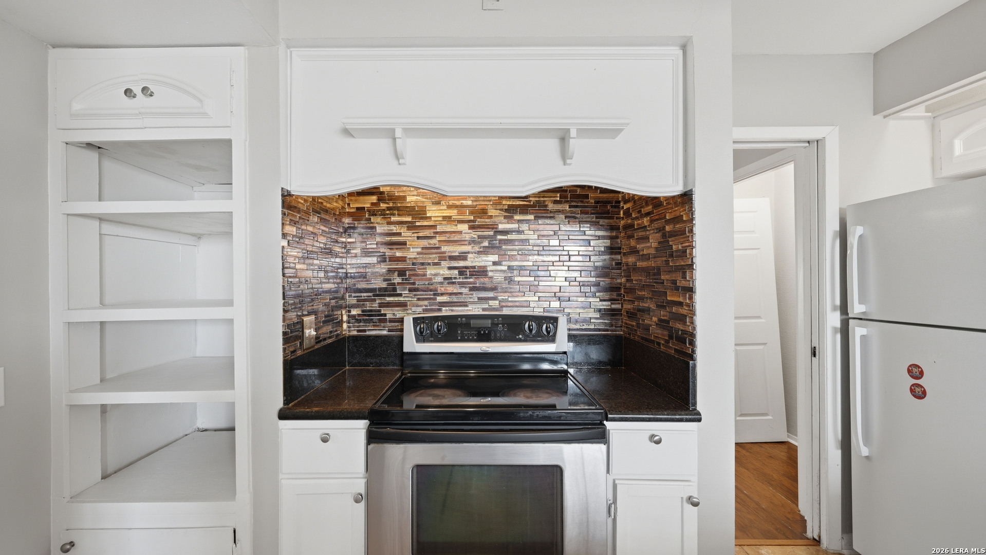 7500 Callaghan Road, Unit 140 San Antonio, TX 78229 - Photo 18 of 42 a stove top oven sitting inside of a kitchen