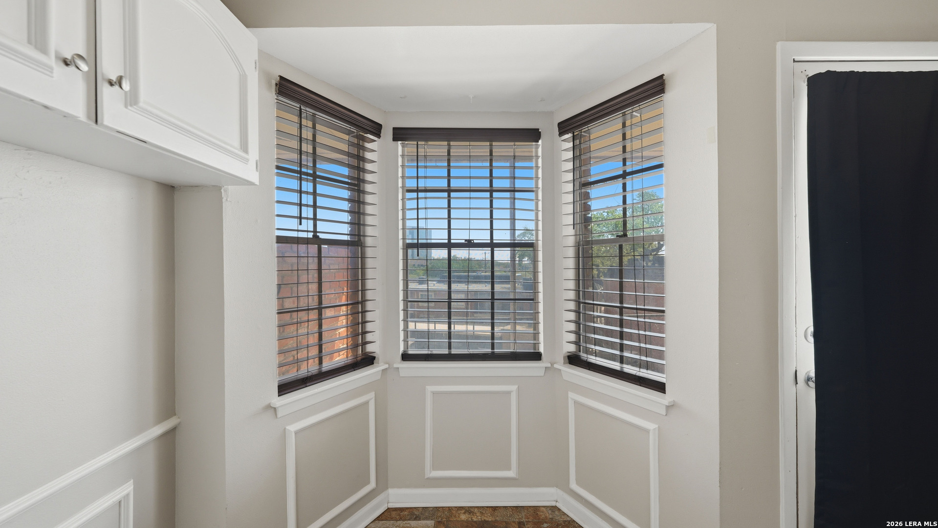 7500 Callaghan Road, Unit 140 San Antonio, TX 78229 - Photo 19 of 42 a kitchen with a window and cabinets