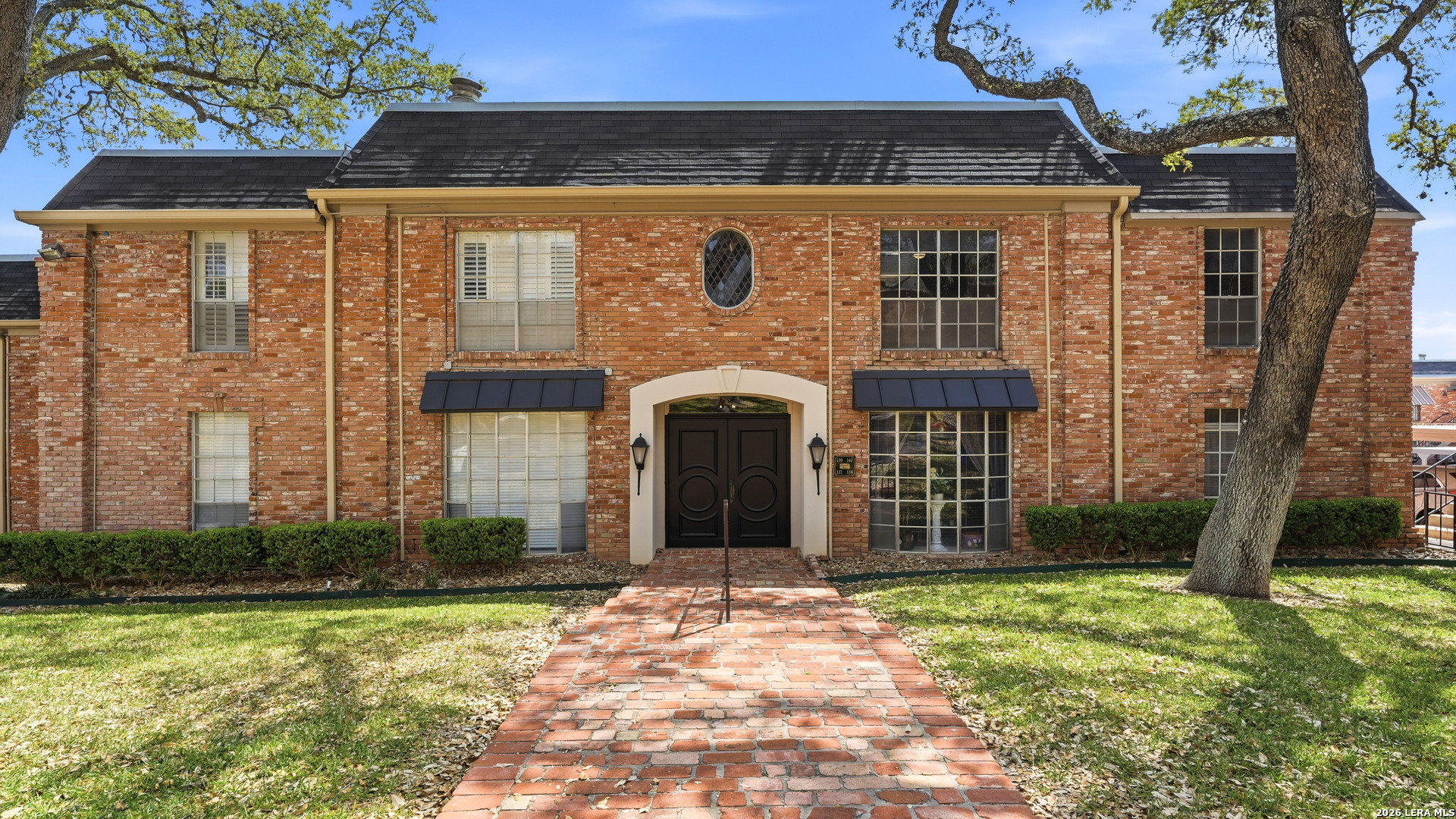 7500 Callaghan Road, Unit 140 San Antonio, TX 78229 - Photo 2 of 42 a front view of a house with a garden