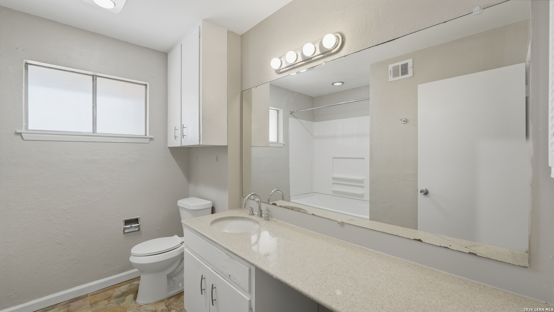 7500 Callaghan Road, Unit 140 San Antonio, TX 78229 - Photo 25 of 42 a bathroom with a granite countertop sink toilet and shower