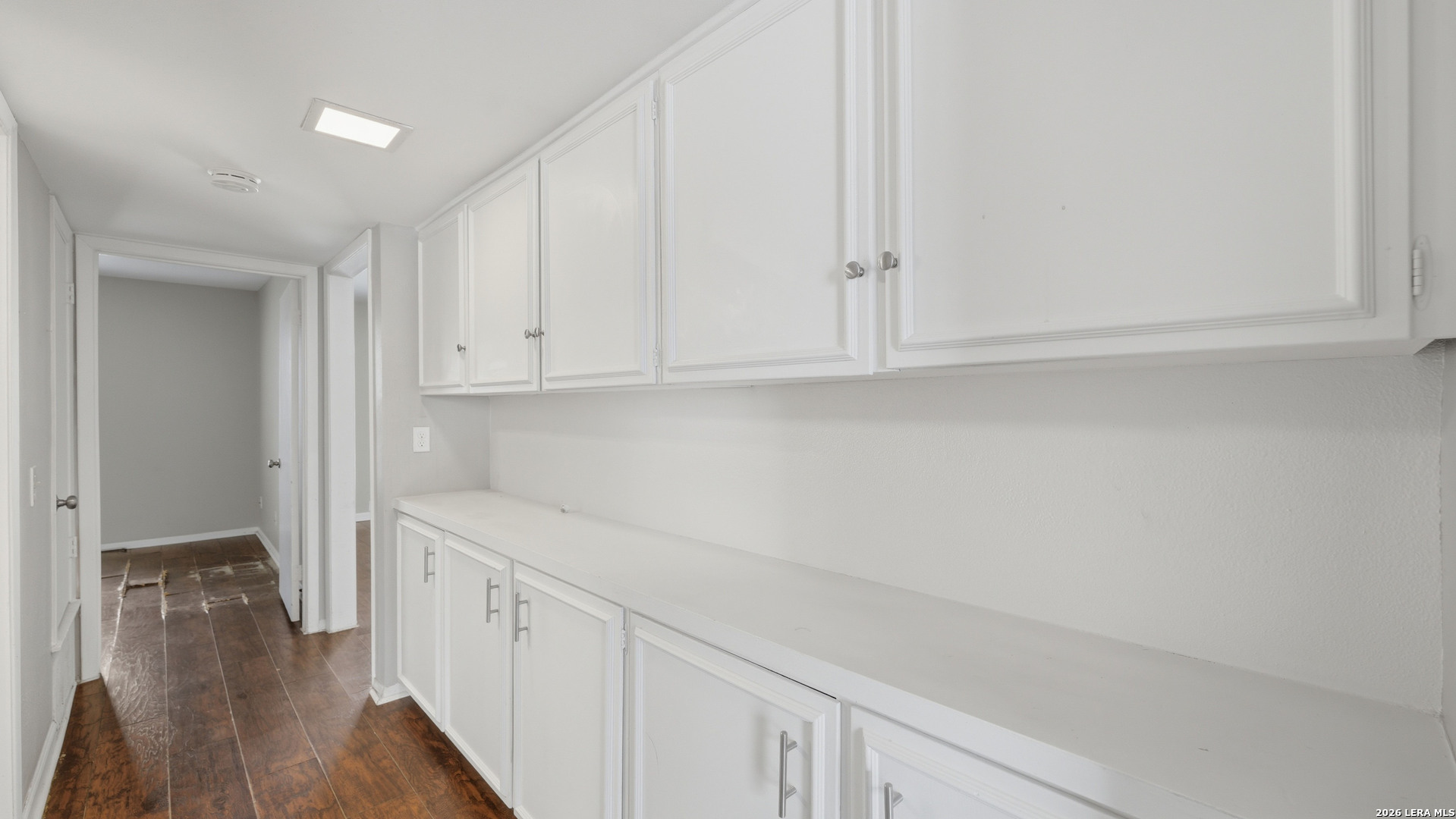 7500 Callaghan Road, Unit 140 San Antonio, TX 78229 - Photo 27 of 42 a view of cabinets and wooden floor