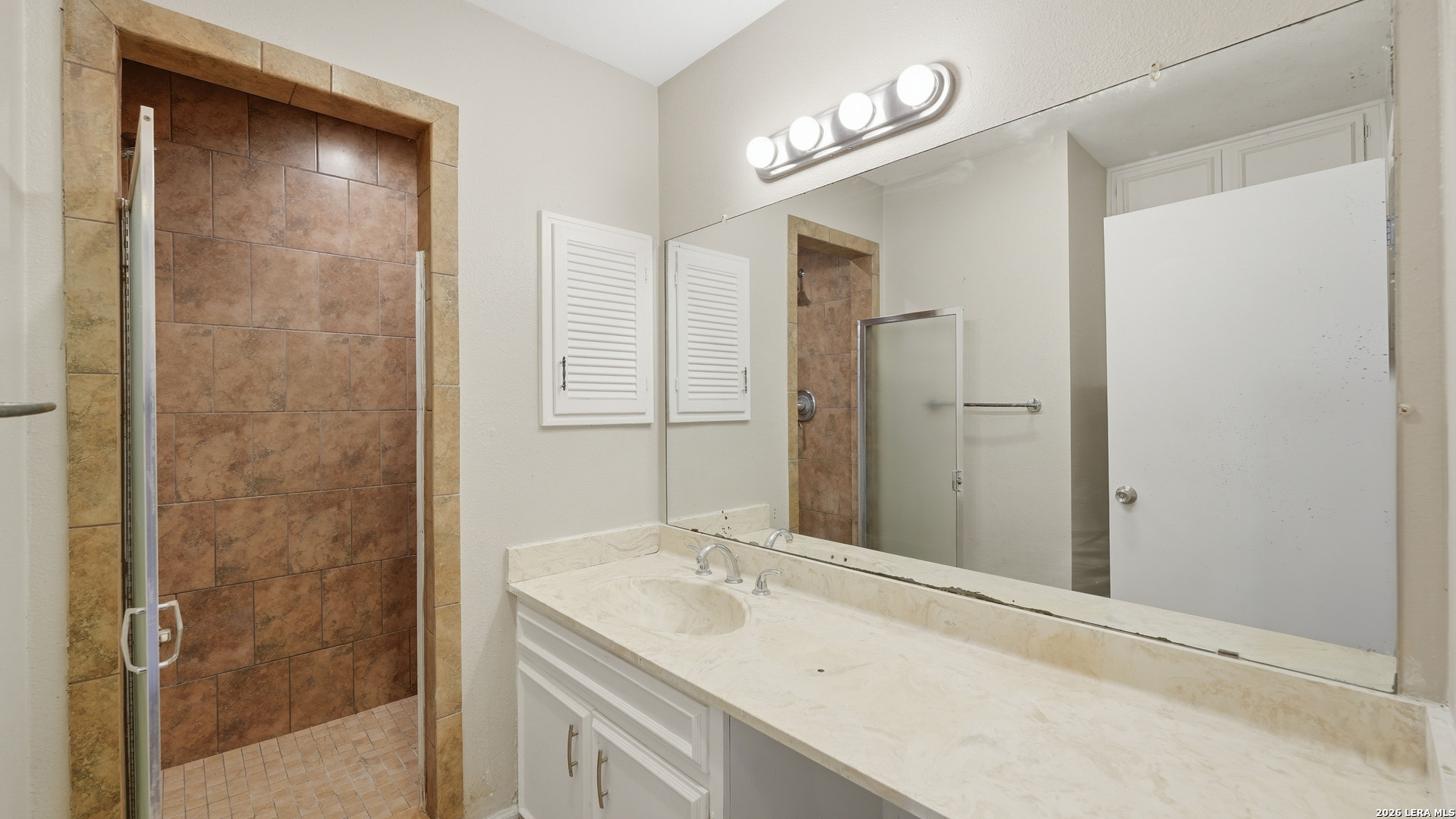 7500 Callaghan Road, Unit 140 San Antonio, TX 78229 - Photo 29 of 42 a bathroom with a sink and a mirror