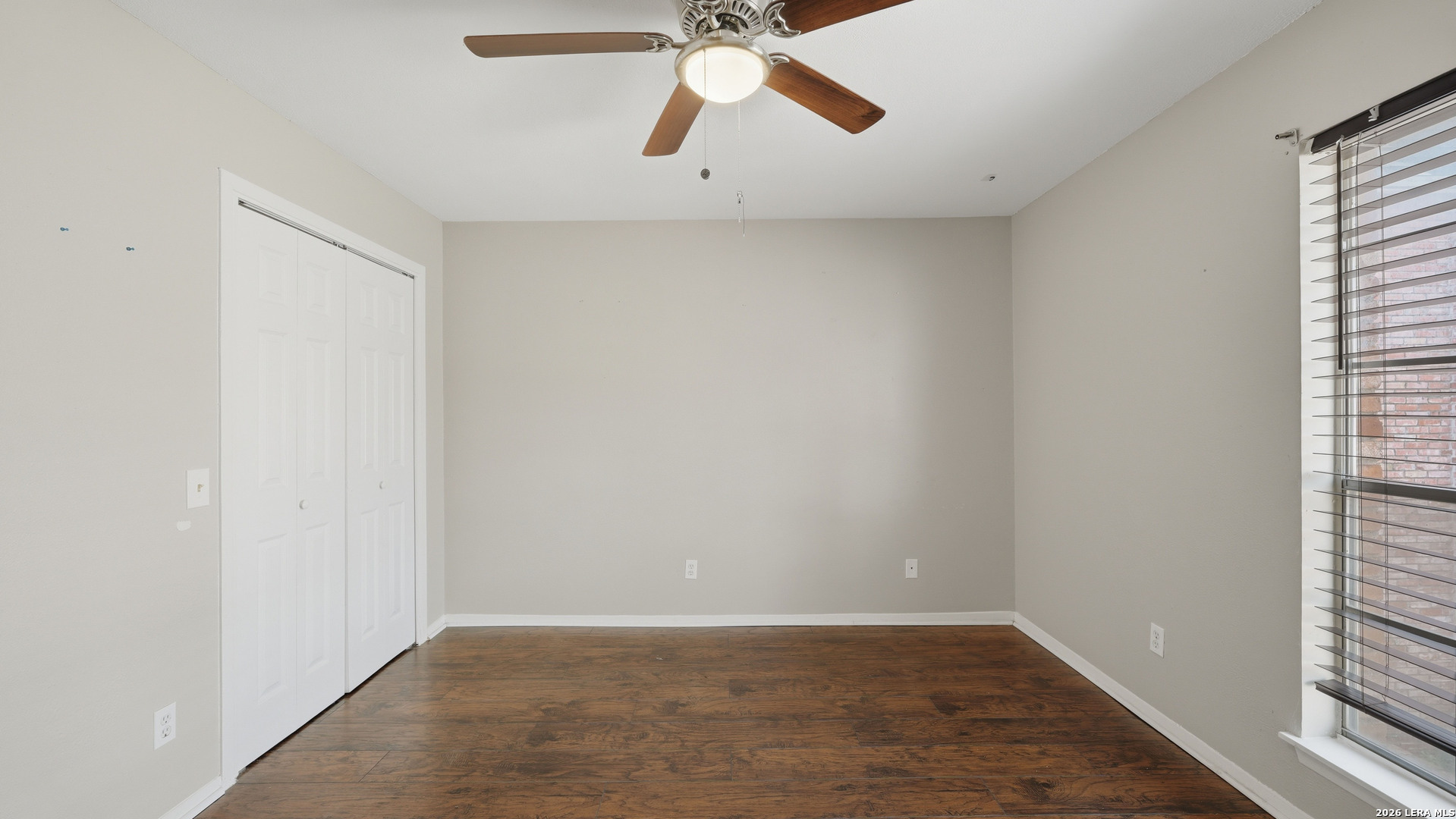 7500 Callaghan Road, Unit 140 San Antonio, TX 78229 - Photo 30 of 42 wooden floor in an empty room with a window
