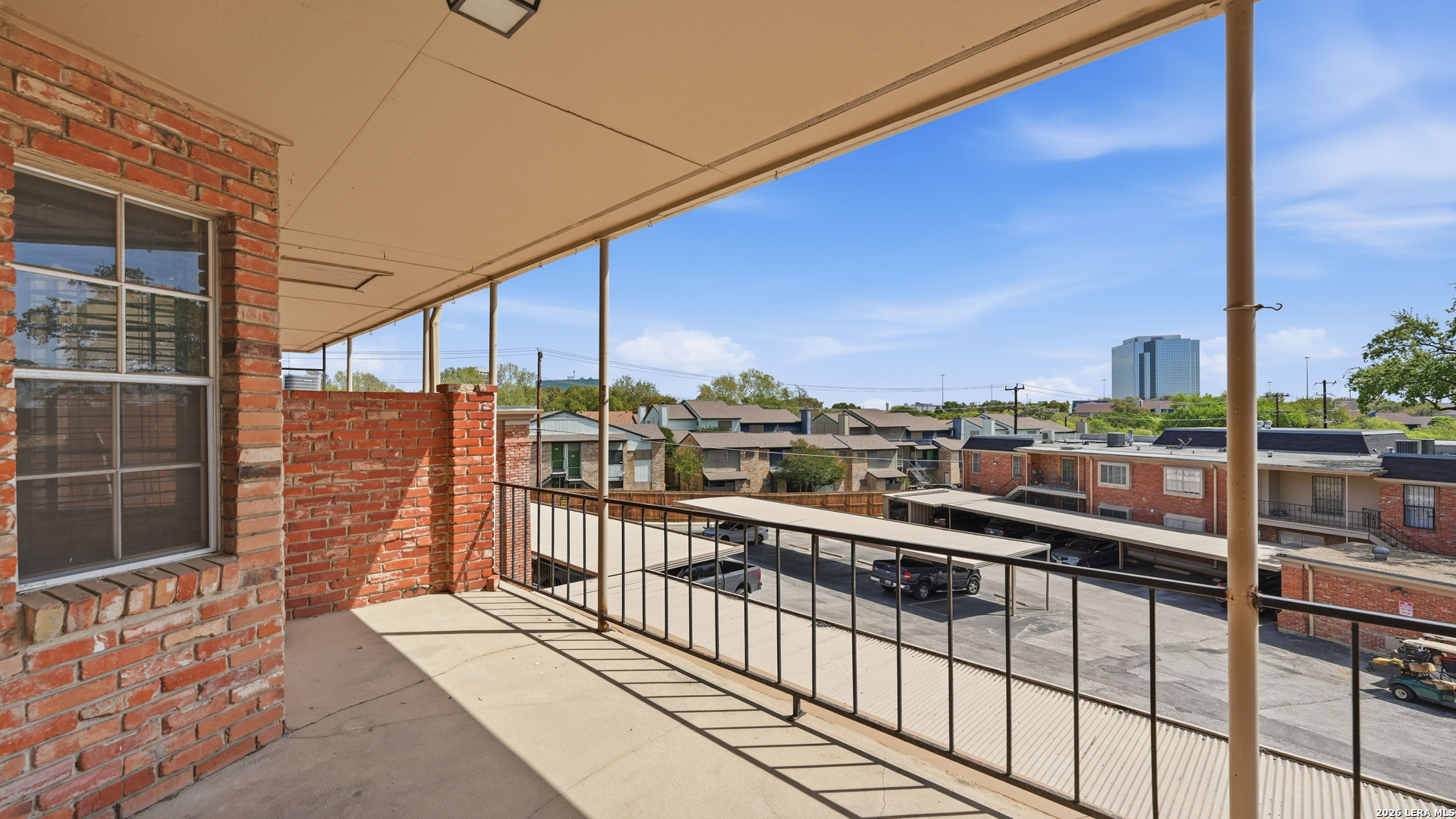 7500 Callaghan Road, Unit 140 San Antonio, TX 78229 - Photo 35 of 42 a view of a balcony with city view
