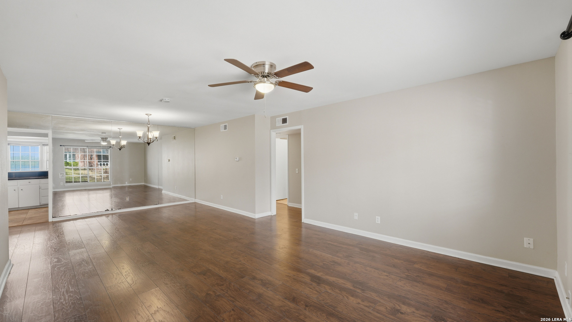 7500 Callaghan Road, Unit 140 San Antonio, TX 78229 - Photo 4 of 42 a view of an empty room with wooden floor