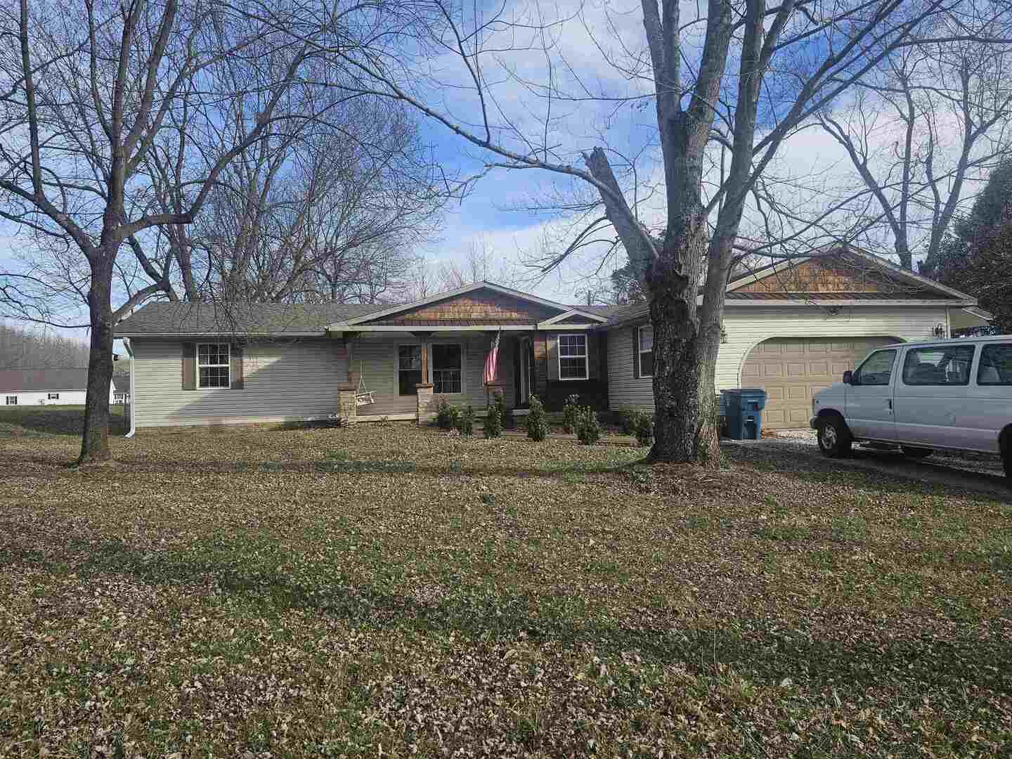 686 Airport Road Metropolis, IL 62960 - Photo 1 of 19 a front view of a house with a garden