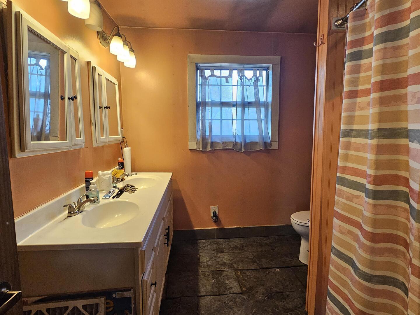 686 Airport Road Metropolis, IL 62960 - Photo 13 of 19 a bathroom with a sink and a mirror