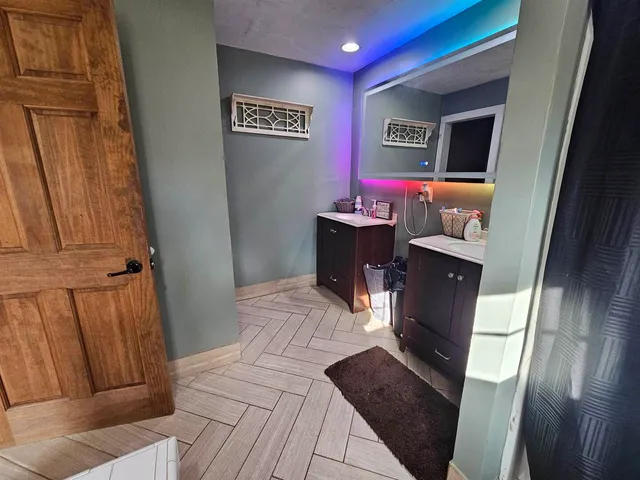 a bed room with a bed and a mirror