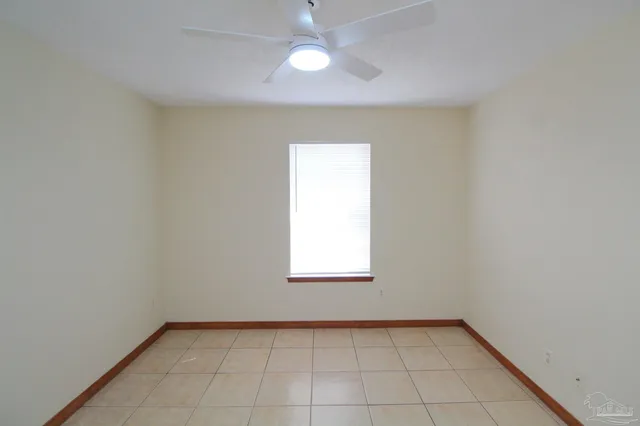an empty room that has a window in it