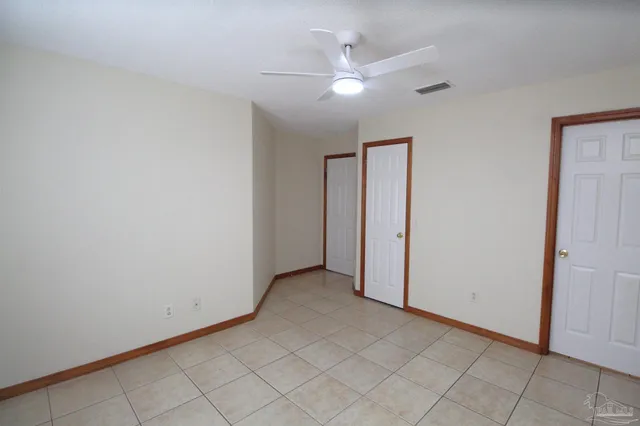 an empty room with fan