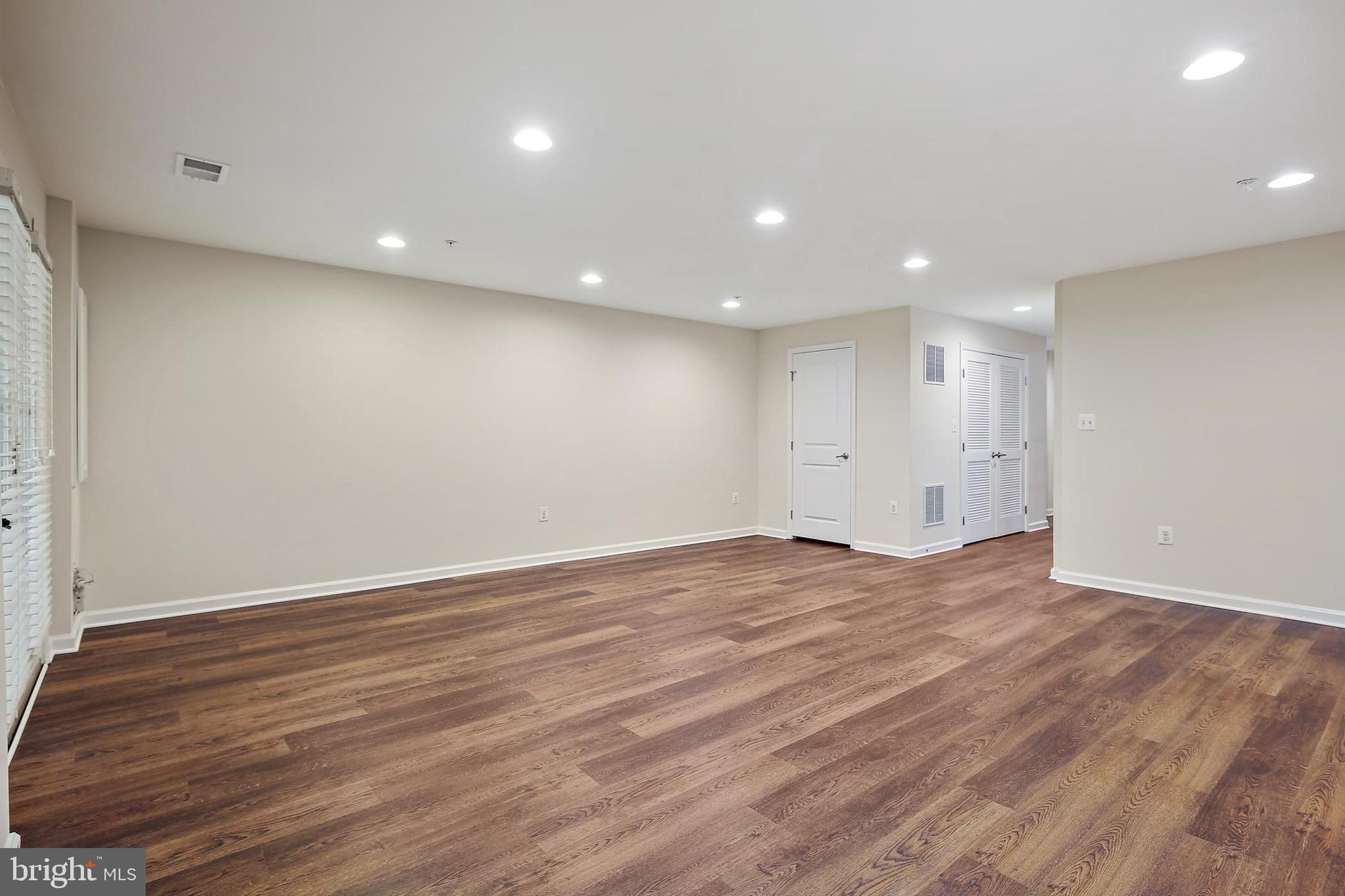 11675 Emerald Green Drive Clarksburg, MD 20871 - Photo 11 of 35 a view of an empty room with wooden floor