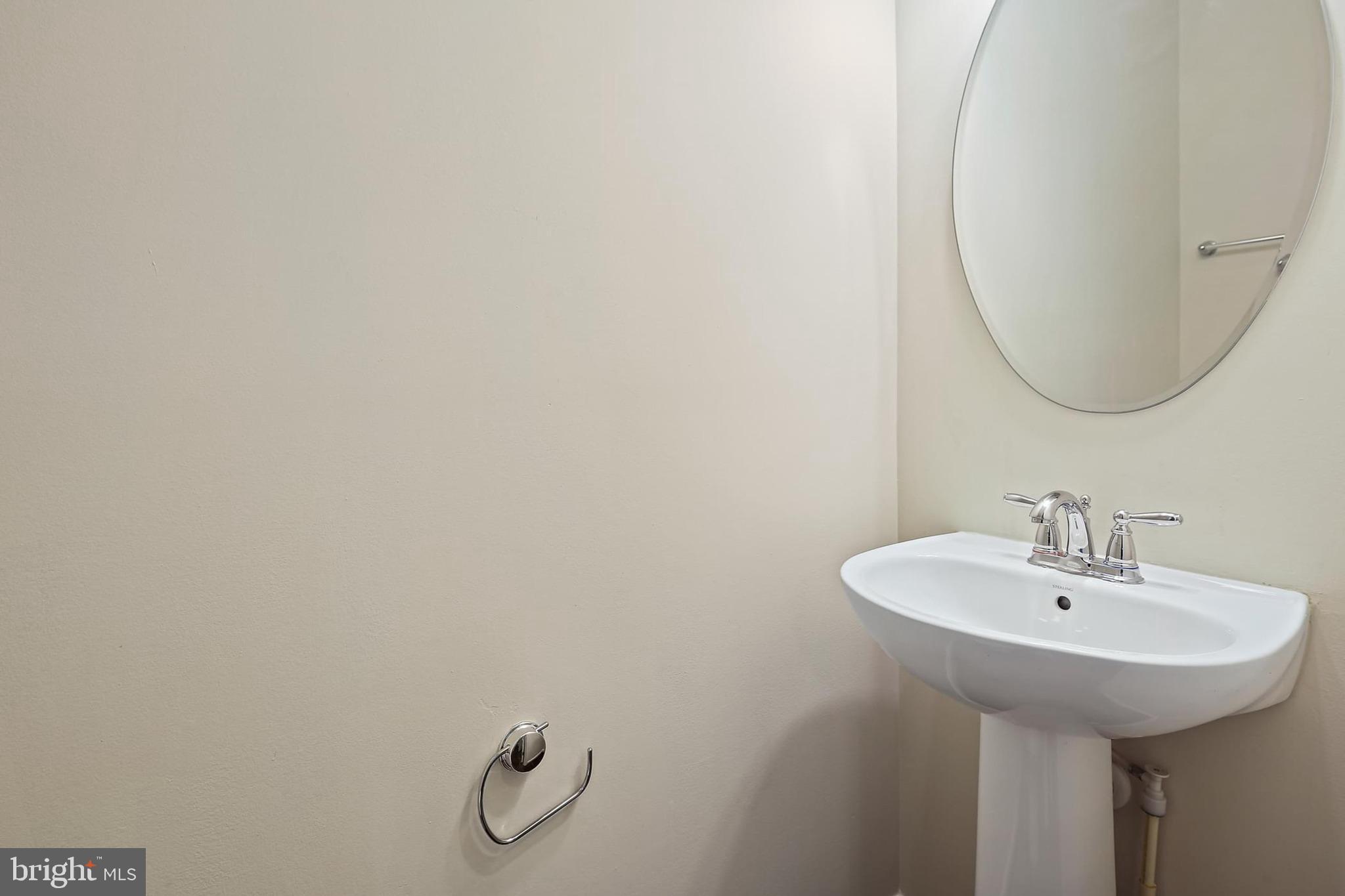 11675 Emerald Green Drive Clarksburg, MD 20871 - Photo 13 of 35 a bathroom with a sink and a mirror