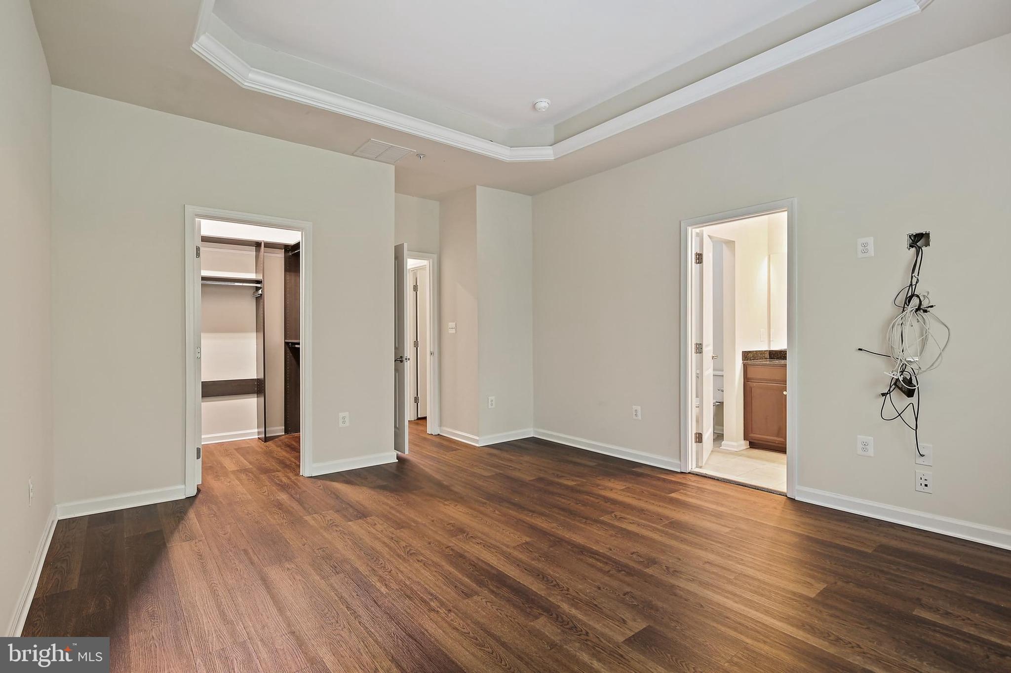 11675 Emerald Green Drive Clarksburg, MD 20871 - Photo 16 of 35 an empty room with wooden floor and closet