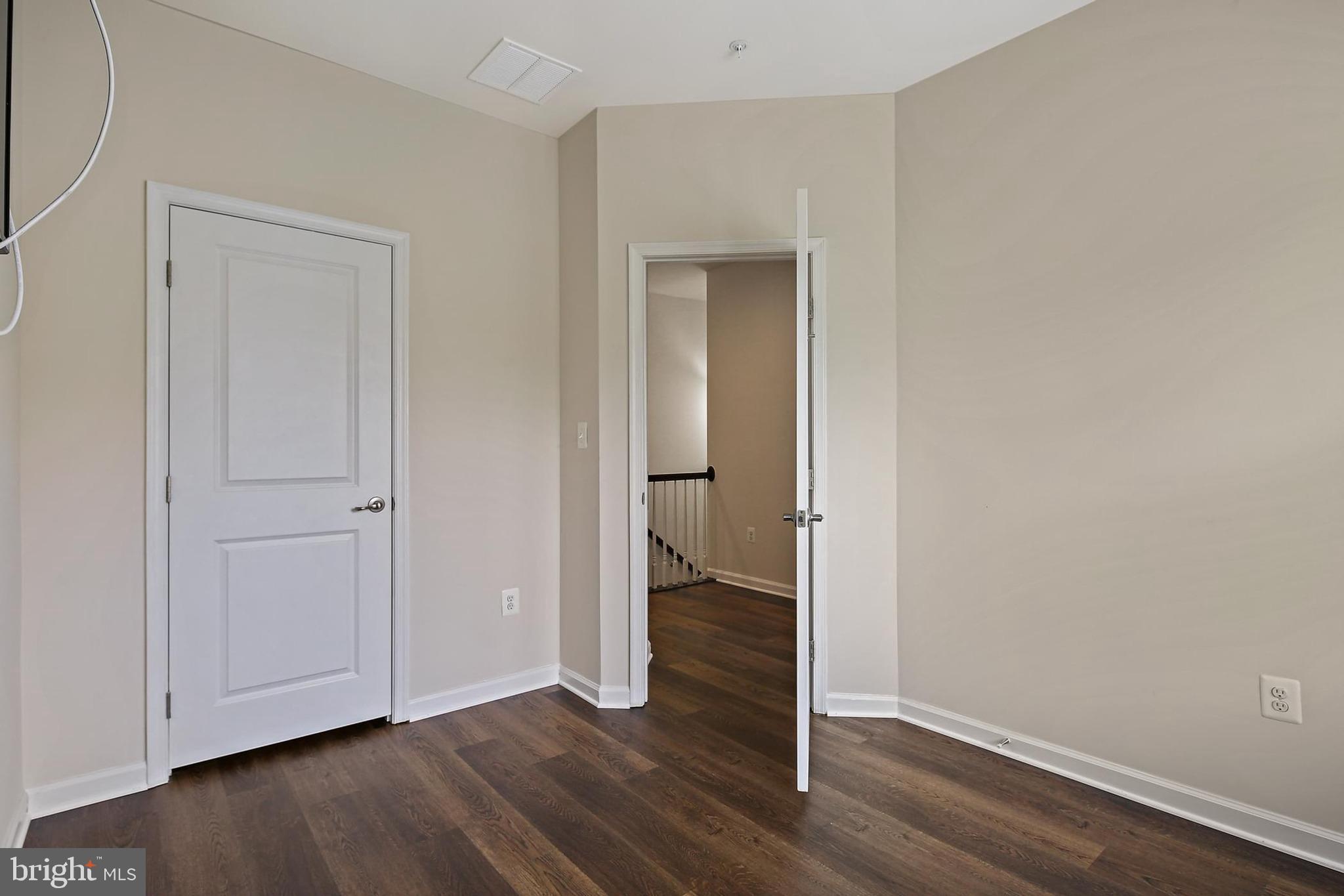 11675 Emerald Green Drive Clarksburg, MD 20871 - Photo 23 of 35 an empty room with wooden floor & closet area
